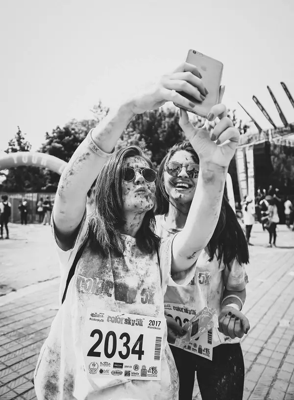 Two women runners taking a muddy selfie after the Mud Runners championship